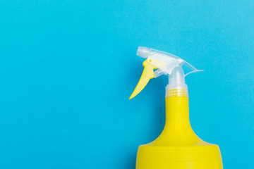 Plastic spray washing bottles with yellow liquid