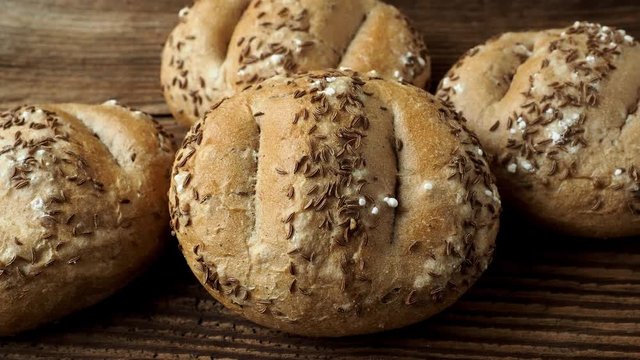 Bread rolls sprinkled with salt and caraway