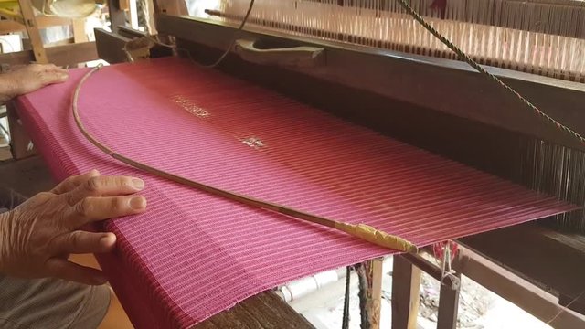 Traditional Thai textile manufacture Weaving thread for the textile industry.