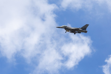 Fototapeta na wymiar f16 falcon fighter jet on sky background