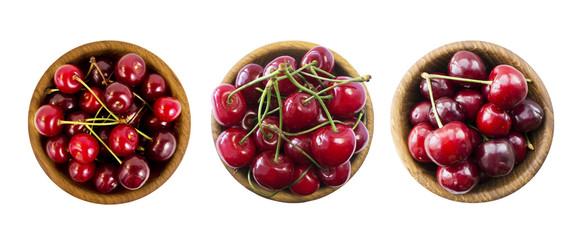 Cherry fruits with bowl on a white. Set of cherries. Fresh red cherries lay on white isolated background with copy space. Background of cherries.