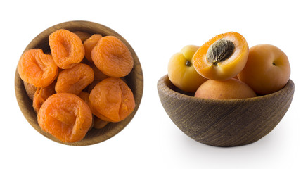 Two bowls with dried apricots and rape apricots in a wooden bowl isolated on white. Dried fruits and fresh fruits with copy space for text. Top view. Apricots on a white background.