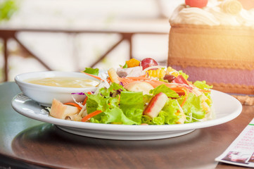 salad with dressing on dish.