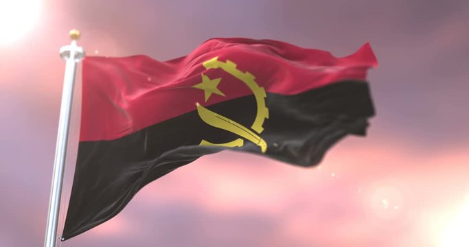Angola flag waving at wind in slow at sunset, loop
