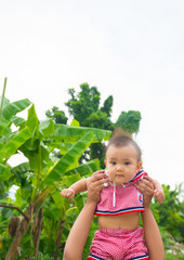 Hand boy brother holding Asian girl sister