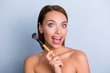 Fototapeta premium Shiny ideal perfect lady silky eyelashes artist girlish feminine nude concept. Portrait of excited astonishedl lady using perfect brush for makeup isolated on grey background