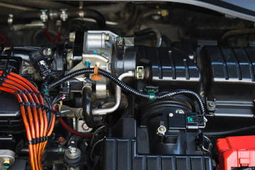 Fototapeta premium Close up detail of clean car engine with red wire.