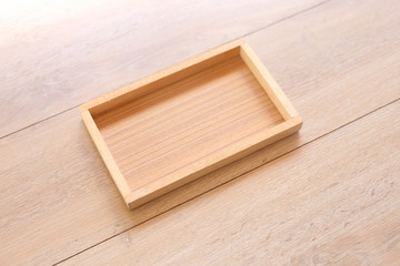 Wooden box on Wood Background, top view.