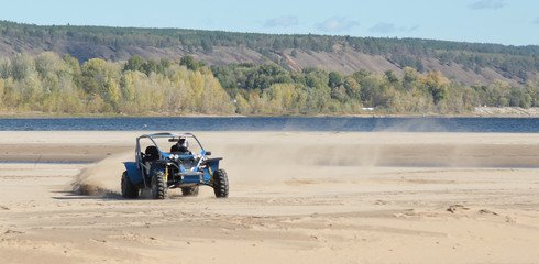Buggy racing on the sand beach