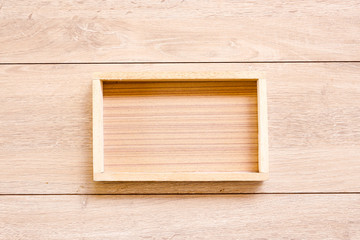 Wooden box on Wood Background, top view.