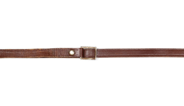 Old, brown leather belt, strap isolated on white background