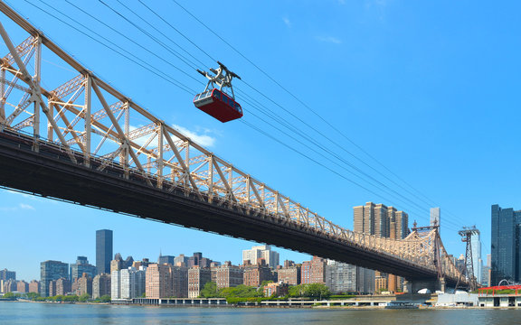 queensboro bridge blue sky, Hudson river and roosevelt island tramway in Manhattan, New York