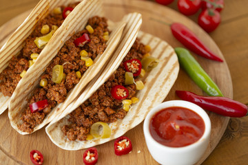 Mexican pork tacos with vegetables and salsa. Top view