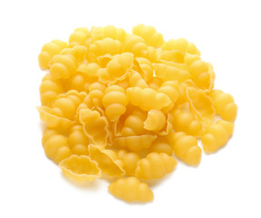 Heap of raw pasta on white background