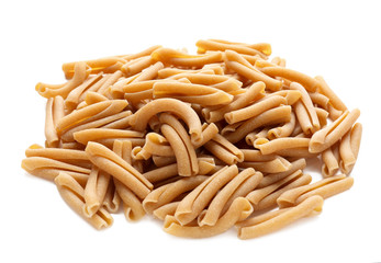 Heap of raw pasta on white background