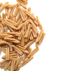 Heap of raw pasta on white background