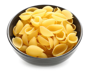 Bowl with raw pasta on white background