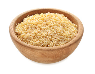 Wooden bowl with raw alphabet pasta on white background