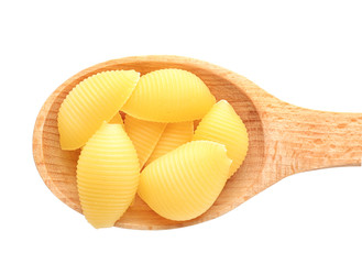 Wooden spoon with raw pasta on white background