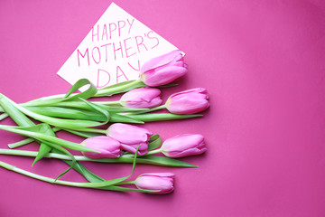 Bouquet of beautiful tulips for Mother's Day on color background