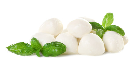 Fototapeta na wymiar Mozzarella cheese balls and basil on white background