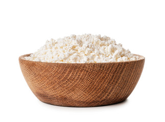 Bowl with tasty cottage cheese on white background