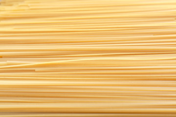Uncooked pasta as background, closeup