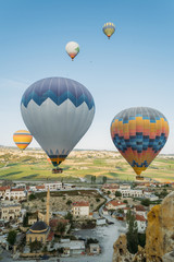 closeup view of colorful hot air balloons over city in Cappadocia, Turkey