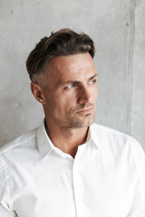 Fototapeta premium Close up portrait of a handsome man in white shirt