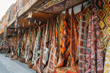 front view of different carpets at market in Cappadocia, Turkey