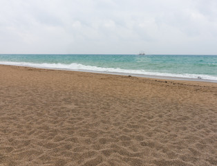 Deserted beach with footprints in the sand