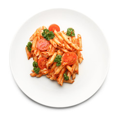 Plate of tasty pasta with tomato sauce on white background, top view
