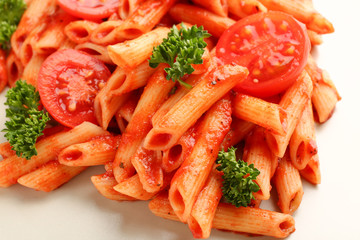 Tasty pasta with tomato sauce on plate, closeup