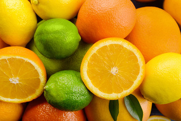 Ripe citrus fruits as background, closeup