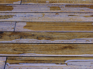 Wooden planks bathed in the rain