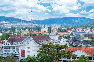 Beautiful houses with in the Da Lat city (Dalat) on the blue sky background in Vietnam. Da Lat and the surrounding area is a popular tourist destination of Asia.