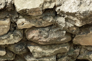 masonry stone wall of large stone limestone