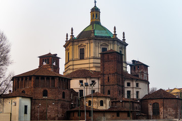 Fototapeta na wymiar Milan, Italy Basilica di San Lorenzo Maggiore facade. External day view of Basilica of Saint Lawrence Roman Catholic Church, one of the oldest in Milano.