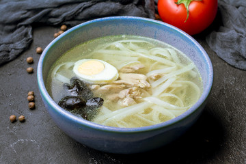 Chicken soup bouillon in a plate