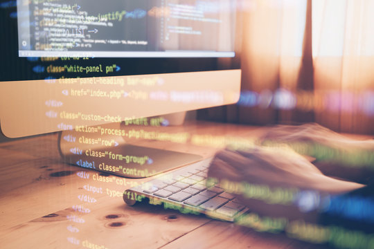 Programmer hands Working at home with computer. Man writing a code. Men programmer hands on the keyboard. Hand coding and showing code graphic on screen. Web Design Business Concep