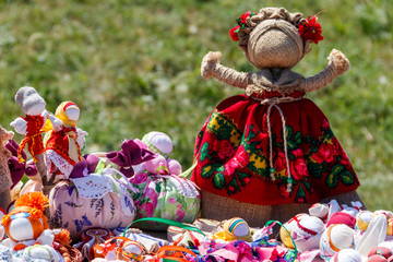 Dolls toys handmade souvenirs at the exhibition of folk arts