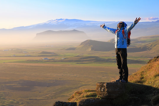Female tourist enjoying the beauty of Iceland landscape