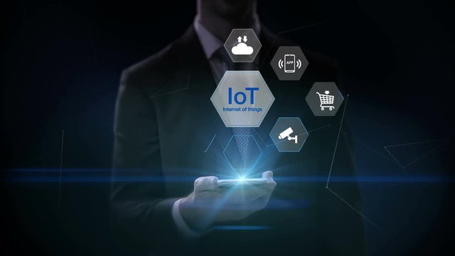 Businessman touch IoT hexagon icon, Home security, cctv, smart city, mobile app, car, internet of thing. 4K movie.