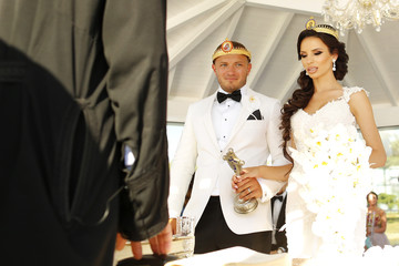 Wedding couple posing in church in orthodox ceremony