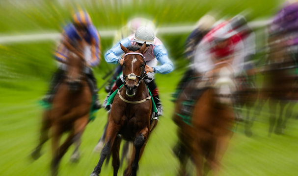 Motion blur zoom effect on lead race horse and jockey turning a corner