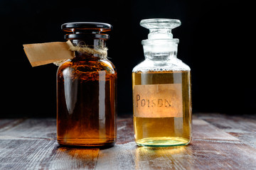 pair of apothecary bottles with potion of poison or tincture