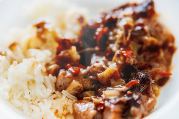 Food from Balkan. Grilled steak with sauce and rice.