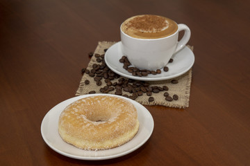 taza de cafe  capuccino y donut