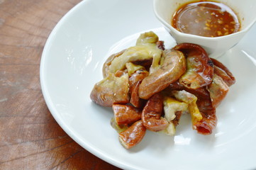 roasted pork fillet slice with spicy sauce on plate