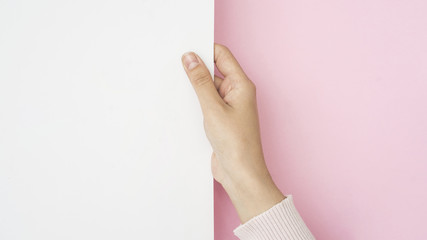 Hand holding blank white paper